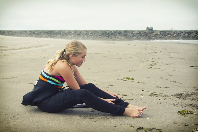 putting on a wetsuit