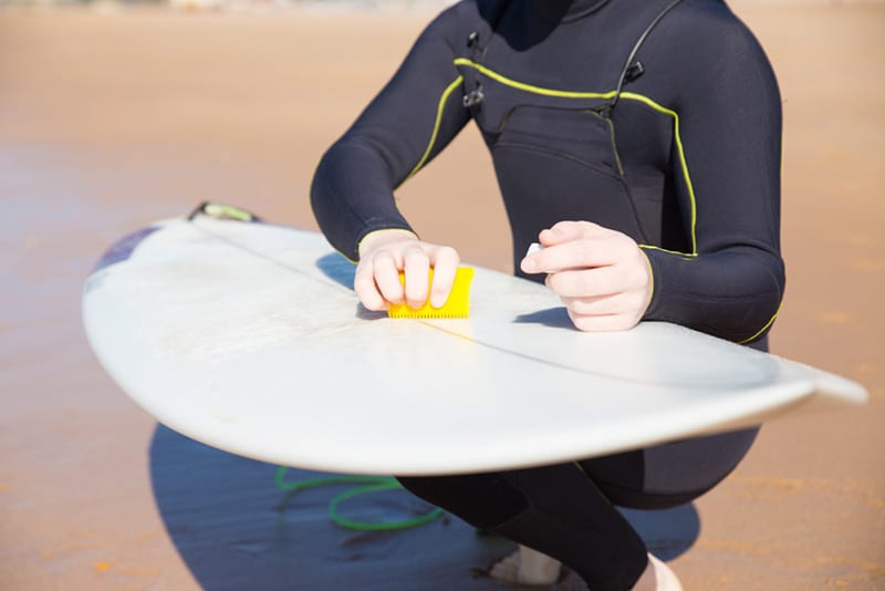 wipe your surfboard with coconut oil